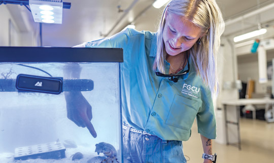 Student conducting water research in the field