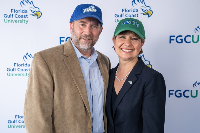 President Elect Timur and Mr. Timur wearing FGCU ballcaps