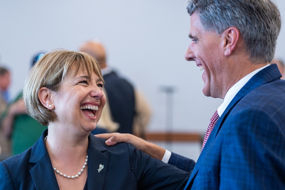 Dr. Chris Westley congratulates Dr. Timur