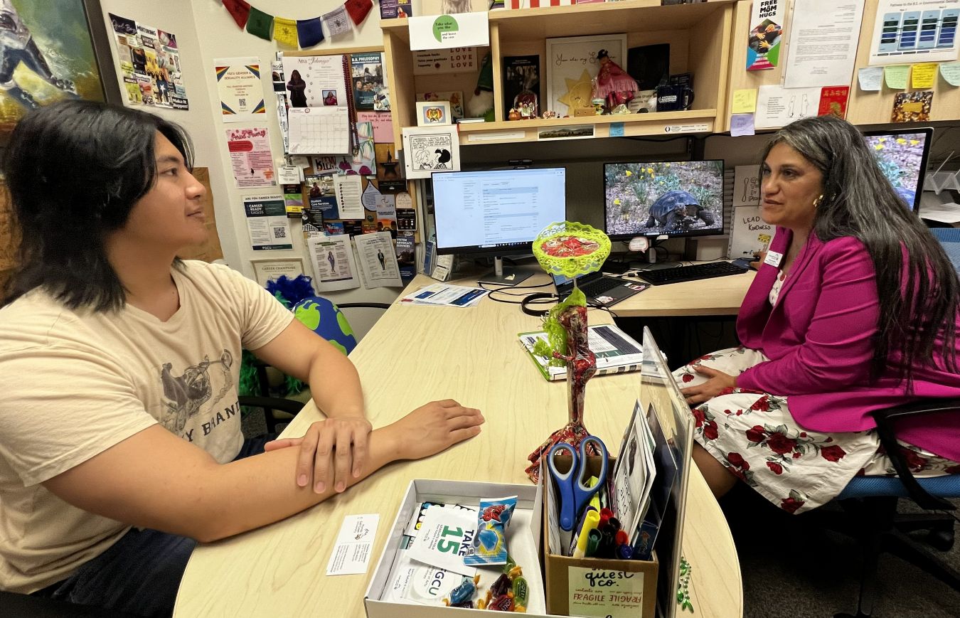 Advisor from The Water School engaging with a student during an in-person advising session.
