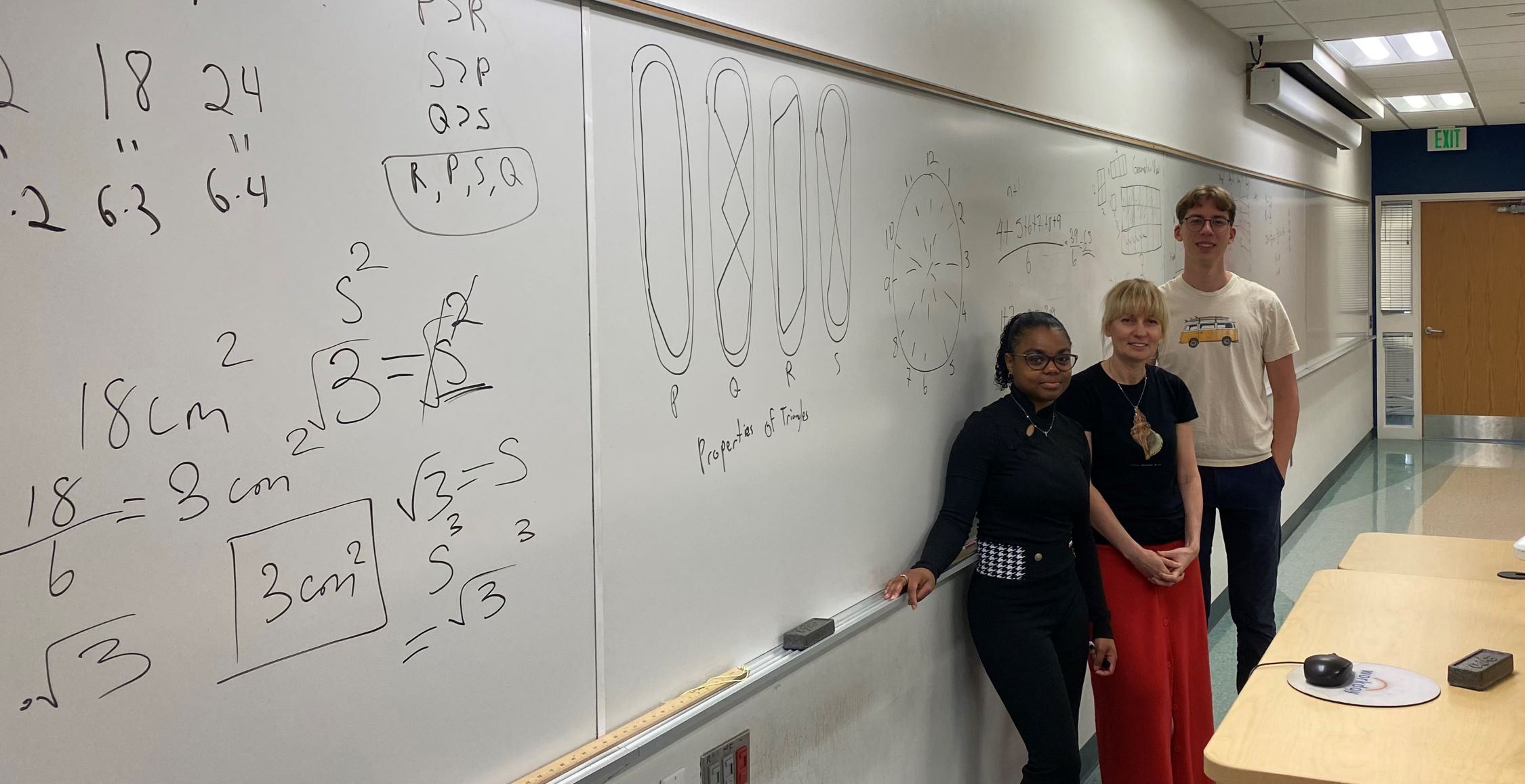 Tanya Huffman, Mathematics Instructor III, collaborating with Seidler Teaching Assistants Kayla Kerr and Mason Huffman, in Seidler Hall, Room 224.