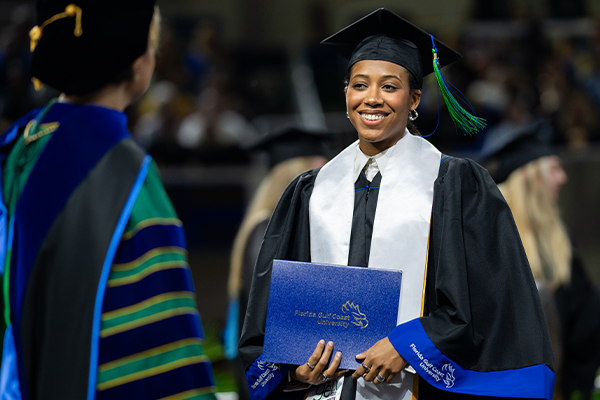 FGCU Complete student at commencement