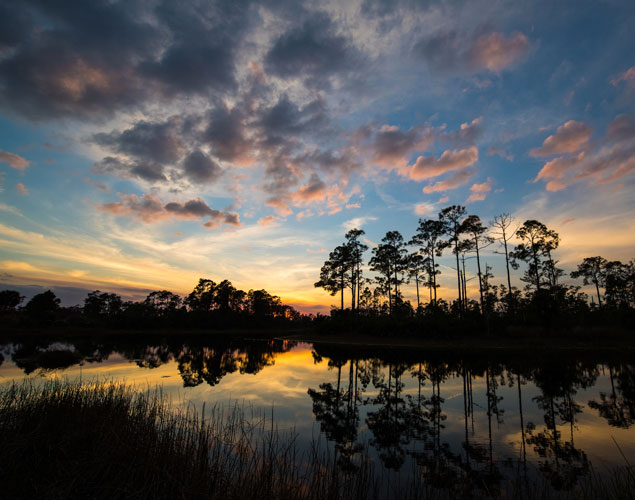 Advancing the mission responsibly Sunset photo over lake
