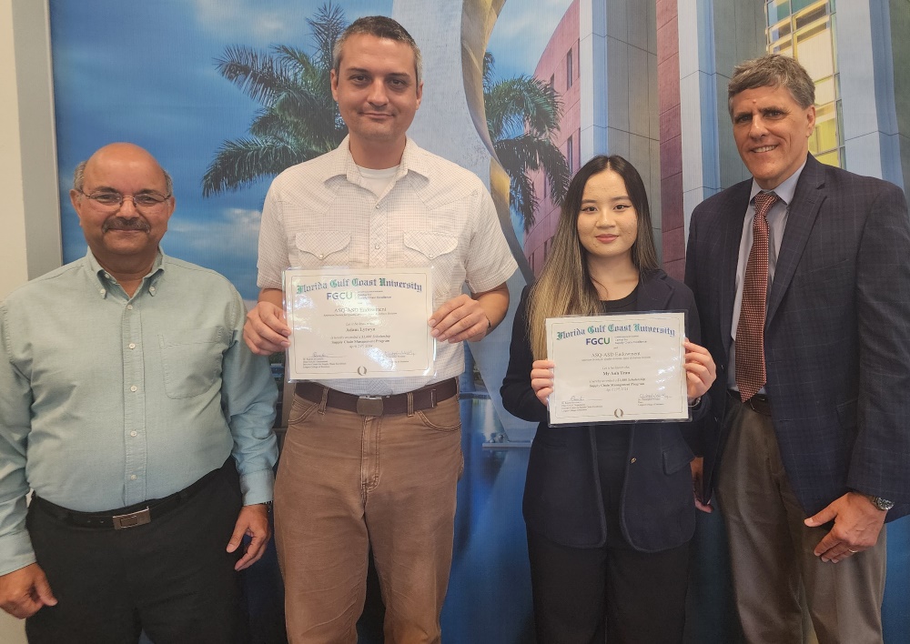 Scholarship Award winners with CSCE Director and Lutgert College Dean. (L-R) CSCE Director Dr. Rajesh Srivastava, Adam Lytwyn, My Anh Tran, and Dean Chris Westley (not available for pic - Lexis Timmerman)