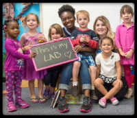 young children holding this is my lab sign