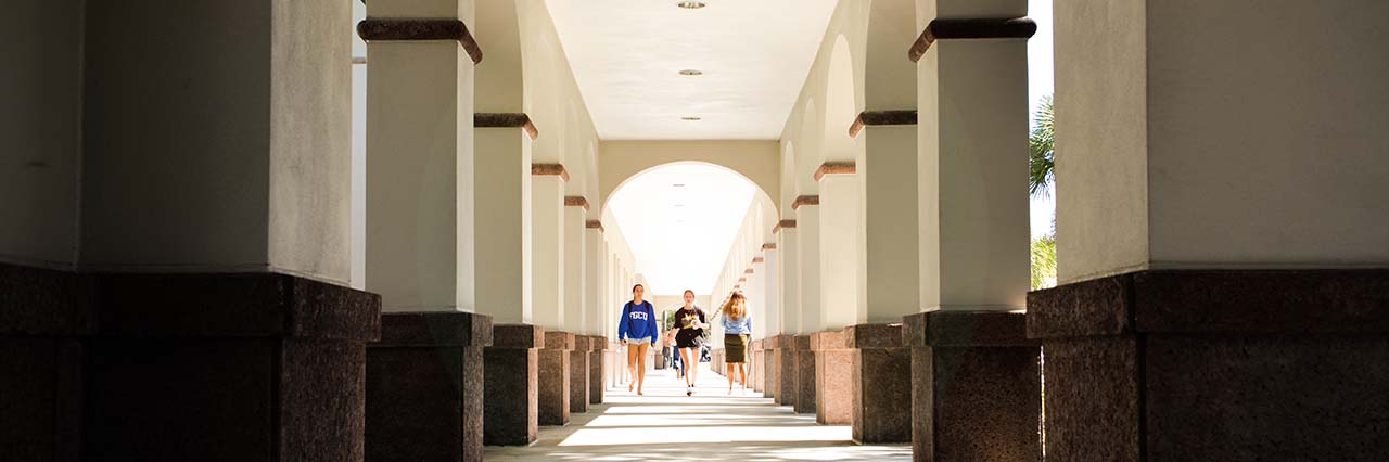 Students walking down corridor