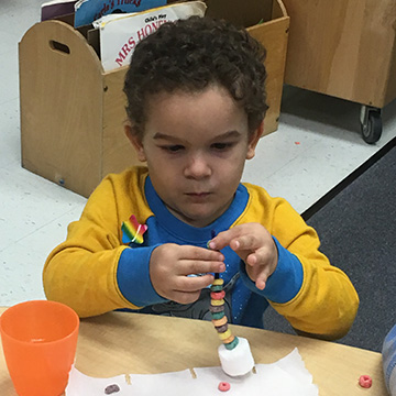 young child learning in the FRC