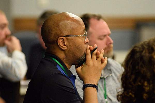 Attendee focused on presentation 