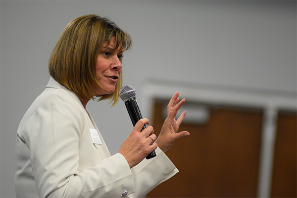 A speaker at the conference discussing digital badges