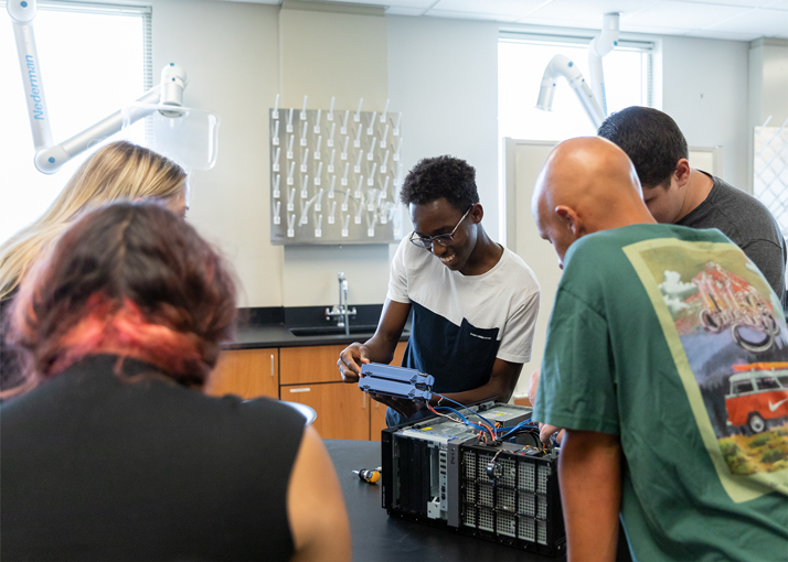 A group of students takes apart a PC