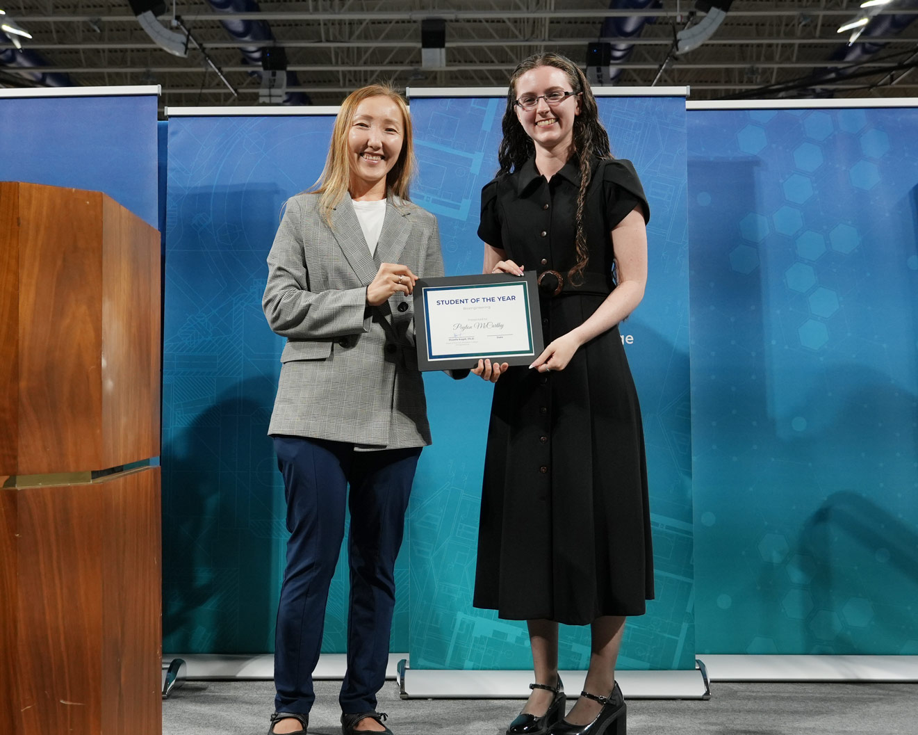 Peyton receives her certificate from Dr. Sypabekova