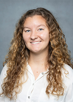 Smiling woman with curly hair