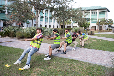 A group of students plays tug-of-war