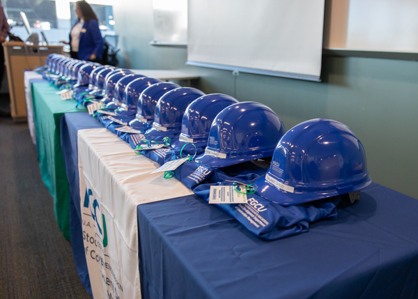 Blue hard hats on a table