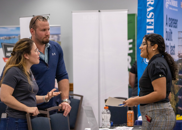 A student talks to employers