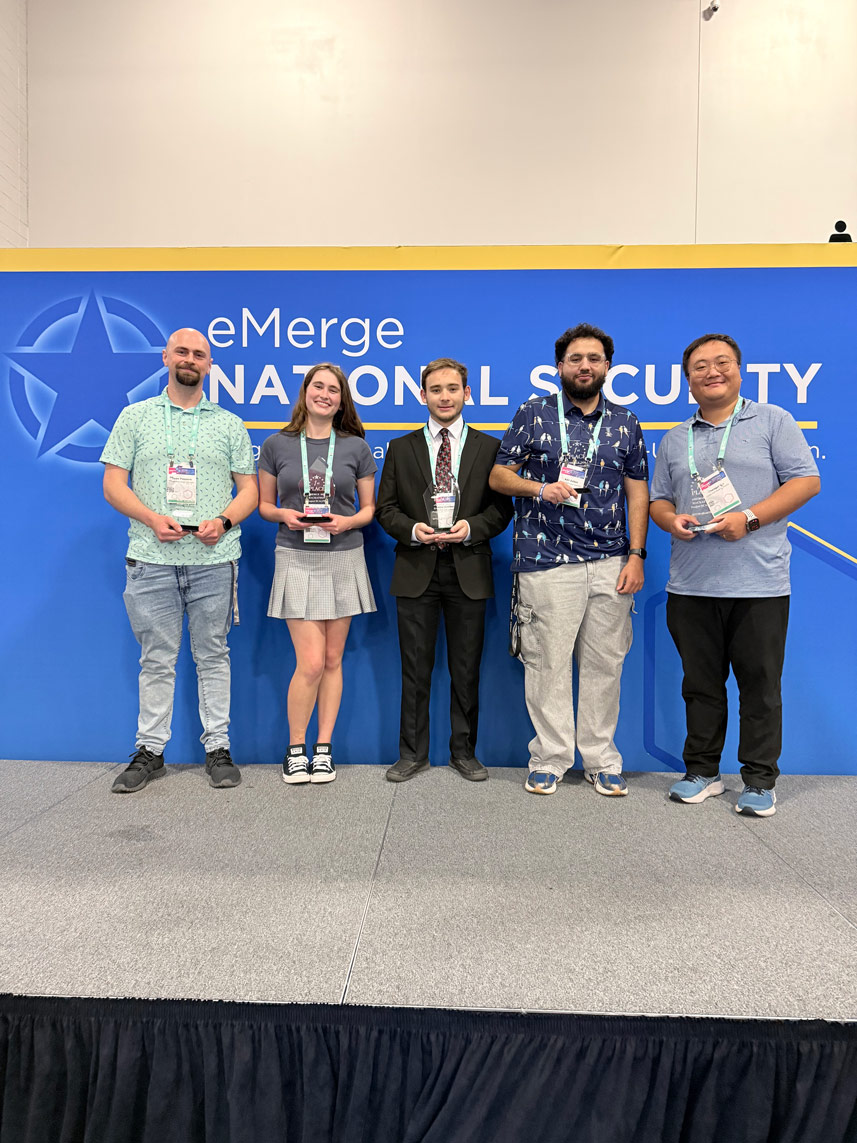 Sean, Katharine, Jeremy, Adil, and Dr. Qu pose with their awards.