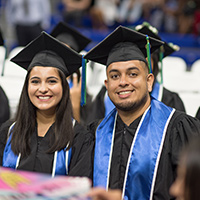 Two students in caps and gowns