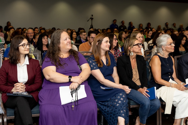 A crowd shot of FGCU employees sitting down as they watch the award ceremony inside the Cohen Student Union Ballroom.