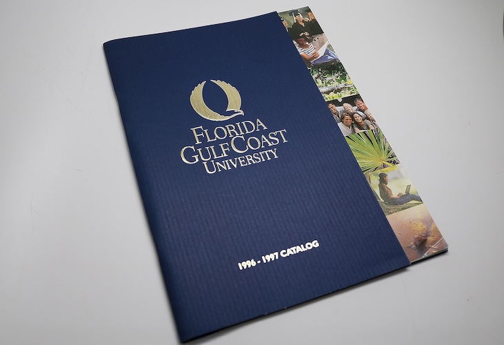 A blue Florida Gulf Coast University catalog from 1996–1997 with the FGCU logo on the cover and a vertical strip of campus photos along the right edge.