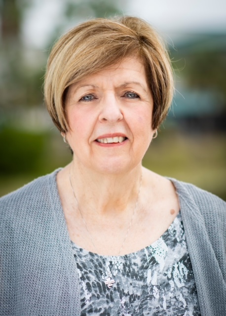 Headshot of Susan Cameron, assistant director of business operations with Student Success & Enrollment Management. She retired Feb. 3. Susan is wearing a light gray cardigan and a grey and white blouse underneath. 