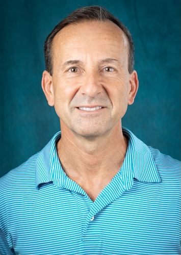 Headshot of Dr. Timothy Yontz. He is wearing a light blue polo shirt.  