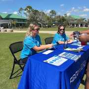 Image of FGCU GIDDI staff at Bloom and Brew engaging in conversations regarding IDD
