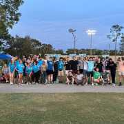 Image of student gathered during kickball game at park