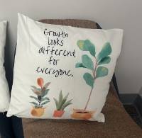 Image of message pillow that states " growth looks different on everyone"