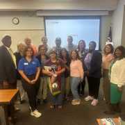 Image of community members with FGCU GIDDI staff at the