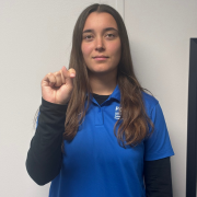 FGCU employee signing T Make a fist, and tuck your thumb between your index and middle fingers.