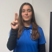 Image of FGCU GIDDI employee signing U Point your index and middle fingers straight up, keeping them pressed tightly together. Curl your other fingers into a fist.