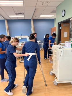 Nursing students practicing gait belts