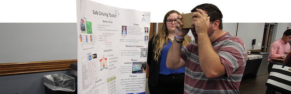 Emily Ennis demos her Safe Driving Toolkit VR Headset at the Entrepreneurship and Innovation Expo