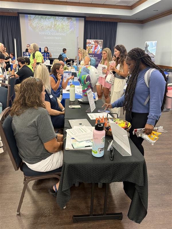 Photo of community member and student talking