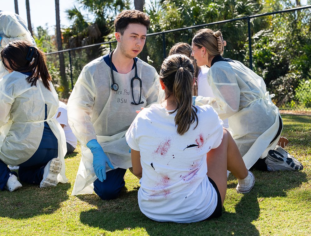 Photo of student weed wacking