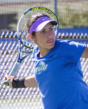 Student playing tennis