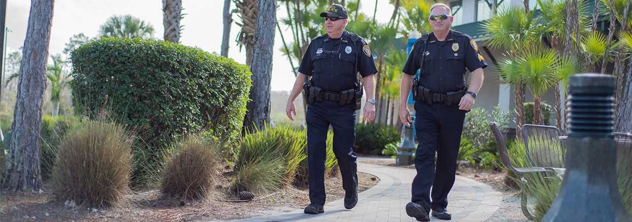 Photo of two UPD officers walking on campus